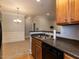 Eat-in kitchen features stainless steel dishwasher, granite countertops and hardwood cabinets at 412 Waterford Lake Dr, Cary, NC 27519