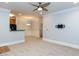 Inviting open-concept living area with carpet, leading into dining and kitchen spaces at 412 Waterford Lake Dr, Cary, NC 27519