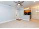 Inviting open-concept living area with carpet, leading into dining and kitchen spaces at 412 Waterford Lake Dr, Cary, NC 27519