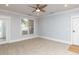 Inviting living room features carpet, crown molding, and abundant natural light enhancing the interior at 412 Waterford Lake Dr, Cary, NC 27519
