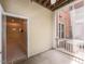 View of an enclosed patio connected to the building's brick facade with interior access and ceiling fan at 412 Waterford Lake Dr, Cary, NC 27519