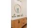 Bathroom with a double sink vanity, wooden cabinets, and modern fixtures at 42 Miry Branch Ct, Garner, NC 27529
