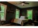 Well-lit bedroom with gray walls, wood flooring, and modern decor at 42 Miry Branch Ct, Garner, NC 27529
