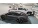 Garage interior showcasing a gray sedan and a white truck, highlighting parking capacity at 42 Miry Branch Ct, Garner, NC 27529
