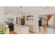 Open-concept kitchen with white cabinets, granite countertops, and views to the living room at 42 Miry Branch Ct, Garner, NC 27529