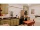 Laundry room with green cabinetry and modern washer and dryer at 42 Miry Branch Ct, Garner, NC 27529