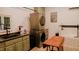 Laundry room with green cabinets, modern appliances, and a dog bath at 42 Miry Branch Ct, Garner, NC 27529