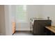 This spacious laundry room features modern washer/dryer and natural light from a window at 42 Miry Branch Ct, Garner, NC 27529