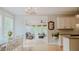 Bright, open-concept living room with hardwood floors connecting dining and sunroom, perfect for entertaining at 42 Miry Branch Ct, Garner, NC 27529
