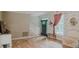 A charming living room boasts hardwood floors, elegant wallpaper and a cozy sitting area near the front door at 42 Miry Branch Ct, Garner, NC 27529