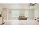 Inviting living space with hardwood floors, windows, and a comfortable sofa at 42 Miry Branch Ct, Garner, NC 27529