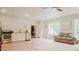 Bright living space featuring stainless steel appliances, a sofa and windows at 42 Miry Branch Ct, Garner, NC 27529