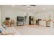 Open-concept living space with stainless steel appliances, tv and a futon at 42 Miry Branch Ct, Garner, NC 27529