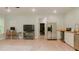 Open-concept living space with stainless steel appliances, tv and dining area at 42 Miry Branch Ct, Garner, NC 27529