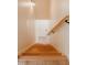 Well-lit staircase with wood treads and a handrail leading to a lower level at 42 Miry Branch Ct, Garner, NC 27529