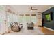 Cozy sunroom with many windows offering ample natural light and backyard views, creating a serene living space at 42 Miry Branch Ct, Garner, NC 27529