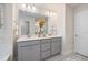 Bright Primary bathroom featuring double vanities, sleek lighting, and modern decor at 425 Shadow Falls Dr, Wendell, NC 27591