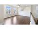 Bedroom with hardwood floors, a ceiling fan and two windows at 425 Shadow Falls Dr, Wendell, NC 27591