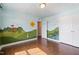 Bright bedroom with beautiful mural and hardwood floors at 425 Shadow Falls Dr, Wendell, NC 27591