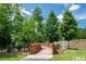 Scenic wooden bridge surrounded by lush greenery and trees in a community park at 425 Shadow Falls Dr, Wendell, NC 27591