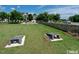 Community lawn with cornhole setups and manicured landscaping at 425 Shadow Falls Dr, Wendell, NC 27591