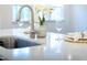 Close-up of a kitchen sink, faucet, and island, creating an elegant and functional workspace at 425 Shadow Falls Dr, Wendell, NC 27591