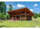 Outdoor pavilion with a fireplace and seating at 425 Shadow Falls Dr, Wendell, NC 27591