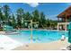 Community pool featuring a splash pad and lounge chairs at 425 Shadow Falls Dr, Wendell, NC 27591