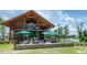 Community pool and outdoor entertainment area with ample seating at 425 Shadow Falls Dr, Wendell, NC 27591