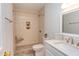 Tiled bathroom with walk-in shower, vanity sink, and decorative accents at 4300 Edgehill Ct, Raleigh, NC 27612