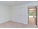 Bedroom featuring carpet, closet doors, and natural light offers a comfortable and versatile living space at 4300 Edgehill Ct, Raleigh, NC 27612