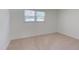 Bedroom with carpet and window offers a bright and neutral space ready for personalization at 4300 Edgehill Ct, Raleigh, NC 27612