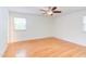 Spacious bedroom with ceiling fan, hardwood floors and windows providing ample natural light at 4300 Edgehill Ct, Raleigh, NC 27612