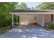 Spacious carport attached to the home, offering covered parking and additional storage space at 4300 Edgehill Ct, Raleigh, NC 27612