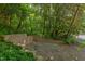 Wide view of driveway with greenery all around at 4300 Edgehill Ct, Raleigh, NC 27612