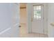 Bright foyer with tiled floors, a glass paneled door, and a glimpse of an adjacent decorated room at 4300 Edgehill Ct, Raleigh, NC 27612