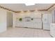 Classic kitchen with white cabinets, appliances, and a bright, airy feel with an adjacent dining area at 4300 Edgehill Ct, Raleigh, NC 27612