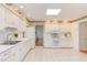 Well-lit kitchen with ample counter space and white cabinetry with a window above the oven at 4300 Edgehill Ct, Raleigh, NC 27612