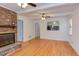 Inviting living room with hardwood floors, a fireplace, and an opening to the kitchen at 4300 Edgehill Ct, Raleigh, NC 27612
