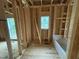 Framed bathroom highlighting the bathtub and window at 5021 Mitchell Town Rd, Youngsville, NC 27596