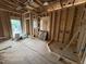 Framed bathroom area highlighting the plumbing for a shower at 5021 Mitchell Town Rd, Youngsville, NC 27596
