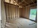 Bedroom framing shows the window, wall studs and subfloor construction offering natural light and ventilation at 5021 Mitchell Town Rd, Youngsville, NC 27596