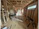 New construction showing the framing of the house with open layout, and natural light at 5021 Mitchell Town Rd, Youngsville, NC 27596
