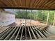 View from the framed house overlooking the backyard and trees, showcasing construction progress at 5021 Mitchell Town Rd, Youngsville, NC 27596