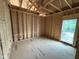 Framed room showcases a window offering natural light and space at 5021 Mitchell Town Rd, Youngsville, NC 27596