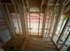 Framed shower area with plumbing in place ready for customization at 5021 Mitchell Town Rd, Youngsville, NC 27596