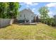 Expansive backyard with patio and lush greenery, offering ample space for outdoor activities and relaxation at 512 Montague Ln, Raleigh, NC 27601