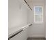 The closet space is well-lit from a window, and features white shelving and dark rods at 512 Montague Ln, Raleigh, NC 27601