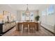 Bright dining area featuring wood table, decorative chandelier, and ample natural light at 512 Montague Ln, Raleigh, NC 27601