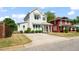Charming two-story home with a well-manicured lawn and a concrete driveway at 512 Montague Ln, Raleigh, NC 27601